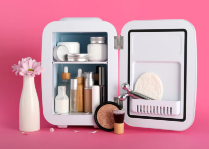Various skin care products in the refrigerator on a pink background